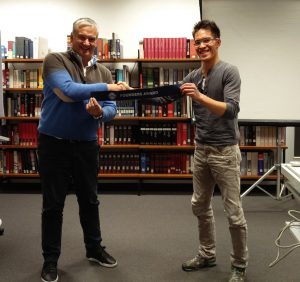 Club President, Peter Bird, and former club President, Phuc-An Tran, with the Founder's Award, which the club received.